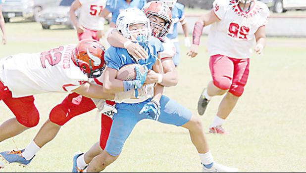 Samoana Sharks ball carrier is brought down near mid field by Joseph Umu (3)
