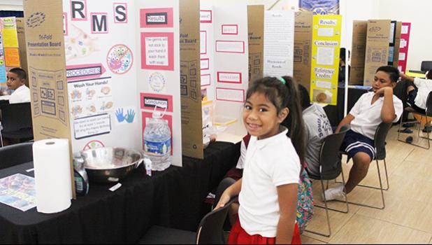  A 2022-23 Science Fair participant with her exhibit