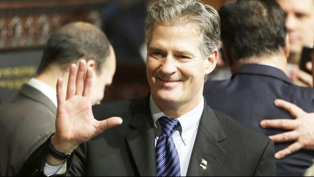 In this Jan. 8, 2015 file photo, former Massachusetts Sen. Scott Brown greets people on the floor of the House Chamber at the Statehouse in Boston. U.S. Ambassador to New Zealand Brown told a New Zealand website Wednesday, Oct. 25, 2017, he accepted advice that he should be more culturally aware after a U.S. inquiry into his conduct at a Peace Corps event in Samoa. The Stuff news outlet says Brown acknowledged complaints were made about his comments to a female food server at the event and to guests upon his arrival in the Pacific country in July. (AP Photo/Steven Senne, File) In this Jan. 8, 2015 file photo, former Massachusetts Sen. Scott Brown greets people on the floor of the House Chamber at the Statehouse in Boston. U.S. Ambassador to New Zealand Brown told a New Zealand website Wednesday, Oct. 25, 2017, he accepted advice that he should be more culturally aware after a U.S. inquiry into his conduct at a Peace Corps event in Samoa. The Stuff news outlet says Brown acknowledged complaints were made about his comments to a female food server at the event and to guests upon hi