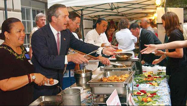 Serving Blue Marlin Tempura at the Western Pacific Regional Fishery Management Council's booth during the 2003 NOAA Fish Fry are (l-r) Council Executive Director Kitty Simonds, Secretary of Commerce Donald Evens, NOAA Administrator Conrad C. Lautenbacher and Honolulu Chef Russel Siu.