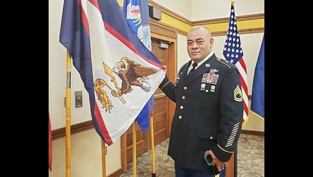  SFC Samasoni Lele’a with the American Samoa flag