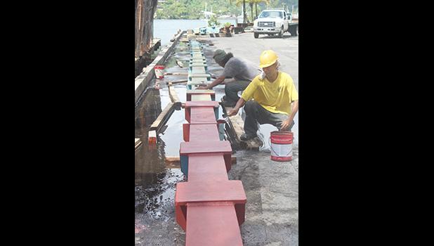 Ronald Reagan Shipyard workers painting the new beams
