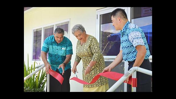First Lady Cynthia Moliga (middle) cutting the ribbon last Friday to officially open the Pacific Sleep Care clinic, which treats sleep apnea. She is assisted by Health director Motusa Tuilema Nua (far left) and Pacific Sleep Care general manager Ferdie Salvador.[photo: AF]