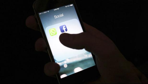 This Feb. 19, 2014, file photo shows the Facebook app icon on an iPhone in New York. Panic over what children are picking up over the Internet sweep social media on a regular basis. In the most recent, children are purportedly encouraged to complete harmful tasks. Though the so-called Momo challenge is believed to be a hoax, other “challenges” and trends should cause concern. (AP Photo/Karly Domb Sadof, File) Screen showing social media logos