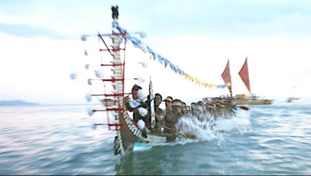A traditional war canoe, Tomoko, from Roviana in the Western Solomons participates in the Pacific flotilla at the opening of the 11th Festival of Pacific Arts in Honiara. June 2012. American Samoa hosted in 2008 and Hawaiʻi will be hosting in 2020.