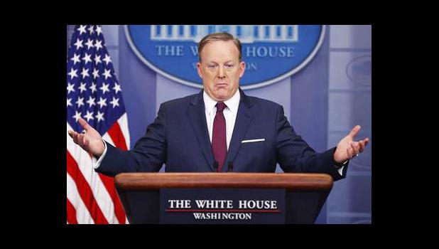  In this March 24, 2017, file photo, White House press secretary Sean Spicer gestures while speaking to the media during the daily briefing in the Brady Press Briefing Room of the White House in Washington. The AP reported on June 9, 2017, that a story claiming Spicer told reporters President Donald Trump has the power to change the way English words are spelled is a hoax. (AP Photo/Pablo Martinez Monsivais, File)