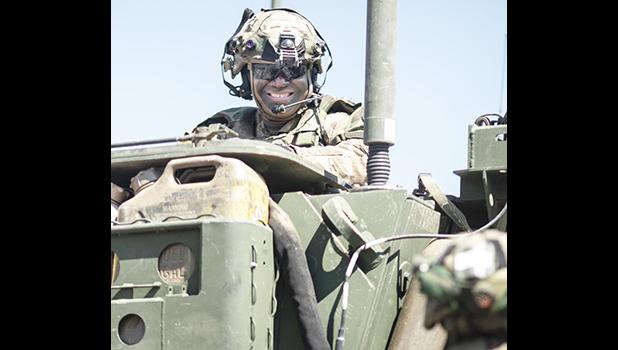 Staff Sgt. Sapa Taala on a tank.