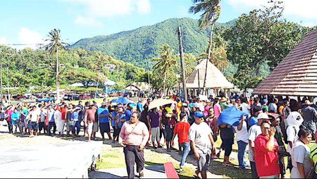 In the sweltering heat, hundreds of employees from StarKist Samoa and Talofa Systems were at the Suigaula ole Atuvasa Beach Park this past Saturday to pick up their care packages and other items donated by "Love Thy Neighbor" and other local businesses. [photo: courtesy]