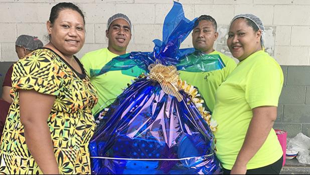 StarKist employees at the canning plant with gifts