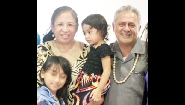 Rep. Su’a Alexander Eli Jennings (right), pictured with his wife and children