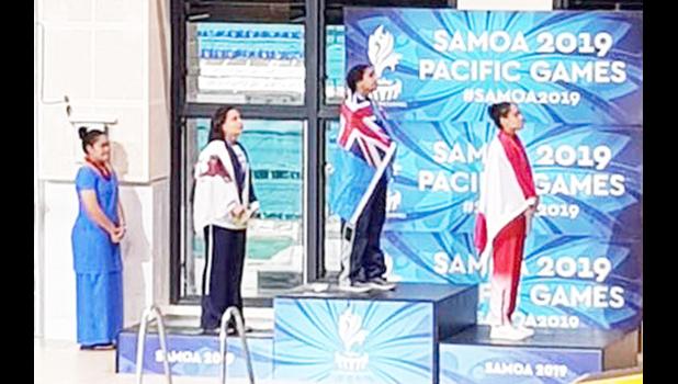 Tilali Scanlan on the pdoium after winning her silver medal with gold winner Moana Wind and bronze, Poerani Bertrand