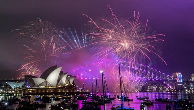Fireworks explode over the Sydney Harbour during New Year's Eve celebrations in Sydney, Monday, Dec. 31, 2018. (Brendan Esposito/AAP via AP) Fireworks explode over the Sydney Harbour