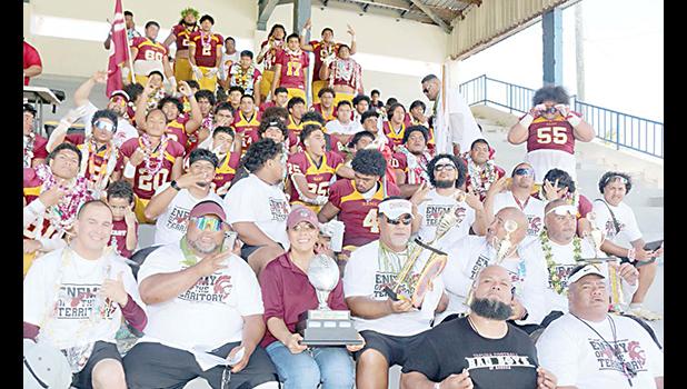 The Warriors football team and coaches