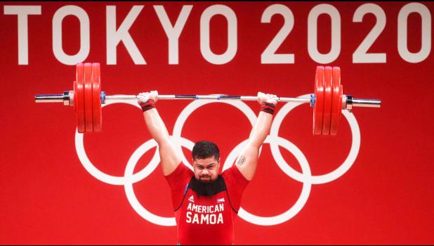 Tanumafili Malietoa Jungblut in front of Olympic logo lifting