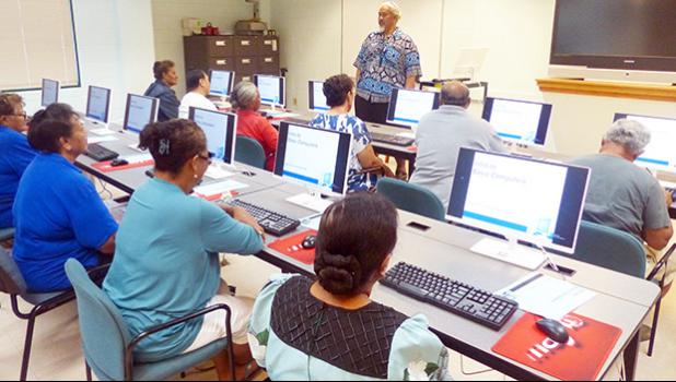 Computer instructor, Loring Fa'iivae (front-standing) of the Feleti Barstow Public Library on Tuesday during the start of the basic computer skills taught class for seniors