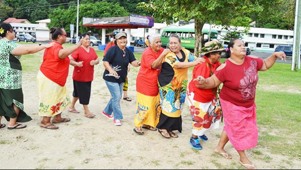 Senior citizens participating in a line dance at Su’igaula