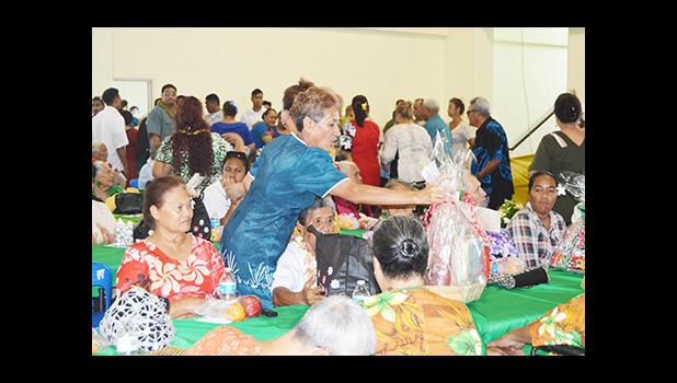 Faauifono Vaitautolu, giving out gift baskets to senior citizens