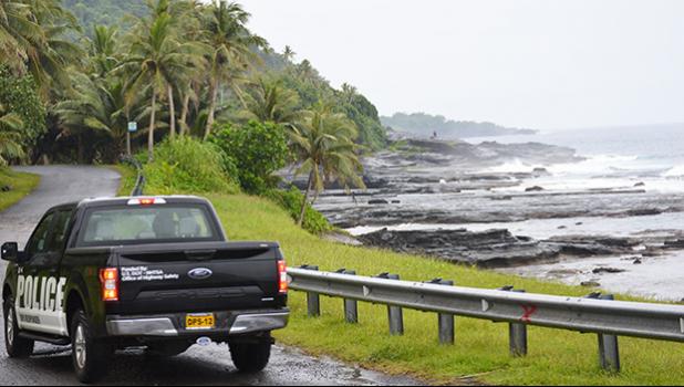 A view of Sliding Rock with a police car in the foreground