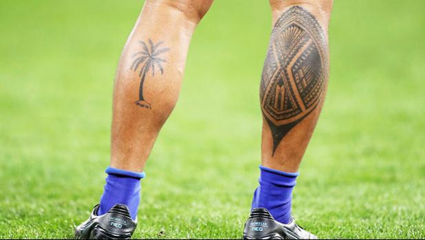 Tattoos on legs of rugby player