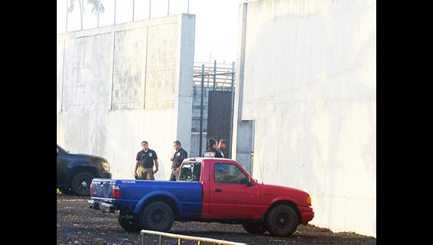 TCF guards changing shifts outside wall
