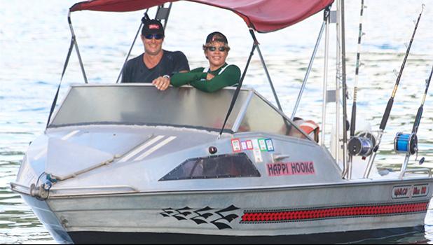 Tisa and Candyman aboard his fishing boat.