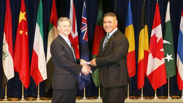 Tolia Tanu Solaita Jr. with FBI Director Christopher Wray