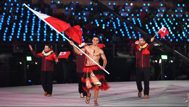  Tonga's flagbearer Pita Taufatofua leads his country's delegation. [Photo: AFP via RNZI]