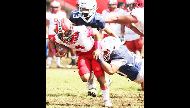 A Samoana defender brings down the Vikings ball carrier