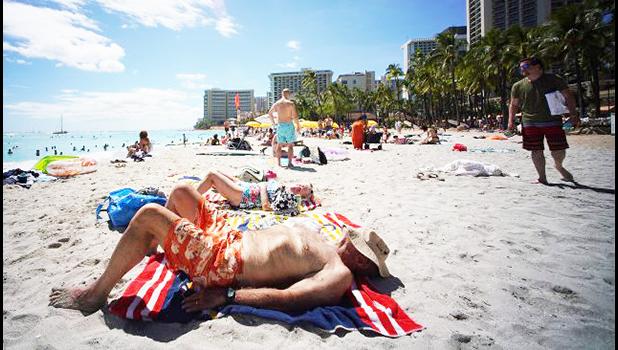 Tourists on Waikiki Beach