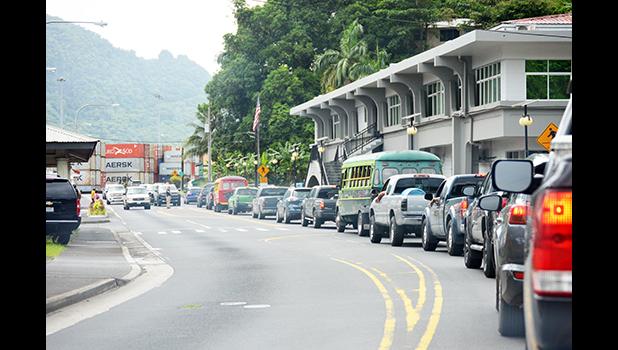 Anytime there is an accident on the road, there is a long line of traffic waiting to move. “Too many cars on the road for a small island,” is the common comment oft received by Samoa News. TRAFFIC BACK UP IN FROM OF POST OFFICE BUILDING
