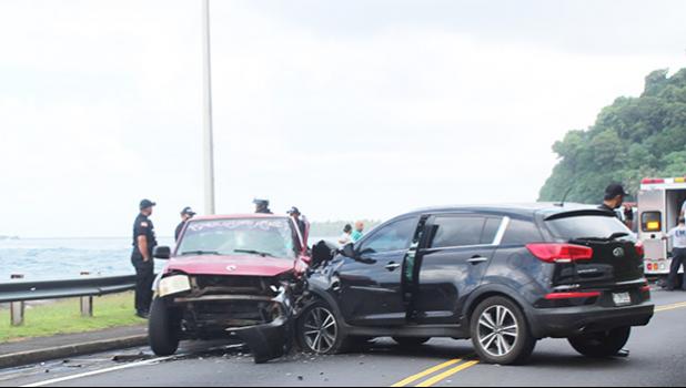 two cars at side of road with damage