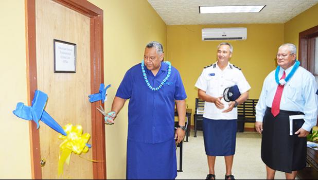 Lt. Gov. Lemanu Peleti Mauga (far left) cuts the ribbon to officially open yesterday morning the Transnational Crime Network center in American Samoa that is overseen by the Department of Public Safety. Looking on are Samoa Police Commissioner Fuiavailiili Egon Keil (middle) and American Samoa Police Commissioner Le’i Sonny Thompson (far right). [photo: AF]