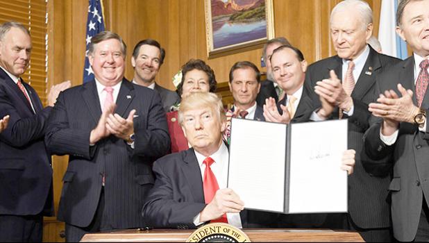 US President Donald Trump holds up the executive order he signed yesterday at the Interior Department building in Washington D.C. that calls for a review of the federal Antiquities Act. Right behind Trump is Congresswoman Aumua Amata, who was invited along with other Congressional members to attend the signing ceremony. Review includes the Rose Atoll of American Samoa and the Pacific Remote Islands marine monuments. Amata has called for the review of these monument designations due to their effect on the te