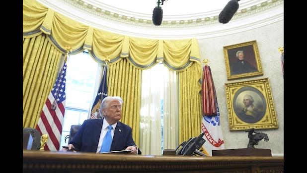 President Donald Trump speaks to reporters as he signs executive orders in the Oval Office of the White House, Tuesday, Feb. 4, 2025, in Washington. (AP Photo/Evan Vucci) President Donald Trump