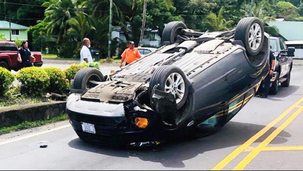 SUV upside down in the road