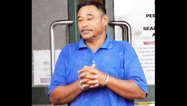 Tusi Fala in handcuffs after his initial appearance in court 