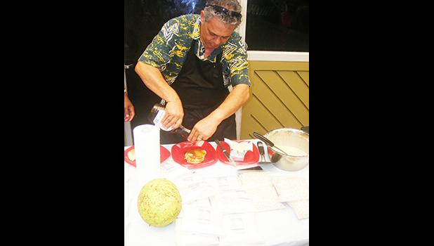 Rep. Su’a Alexander Eli Jennings pours syrup on gluten free breadfruit pancakes during a demonstration last Friday at the Fagatogo market place. [photo: FS]