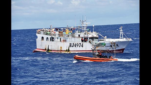 USCG boarding crew heading toward a foreigh vessel