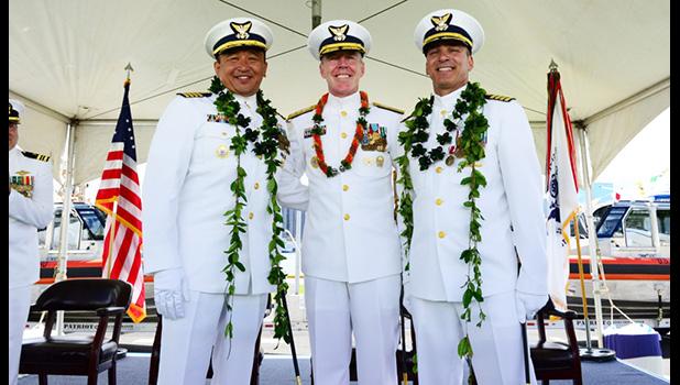 Capt. Arex Avanni (left),Capt. Michael Long (right),Rear Adm. Kevin Lunday (center) 