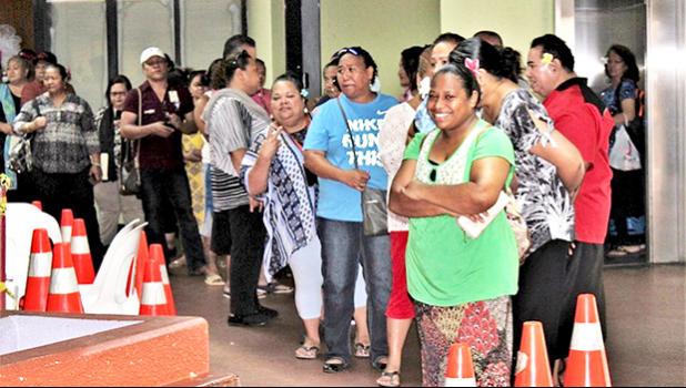 Line of people waiting for vaccinations at the EOB in American Samoa.