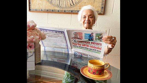 Vera Annesley reading the paper