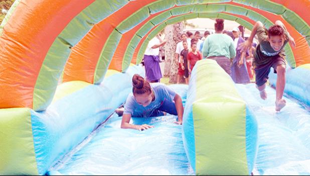 The water slide bounce was a big hit on Saturday during the the 2nd Annual MASI Easter Bash at le Suigaula a le Atuvasa in Utulei. [Photo: EM]