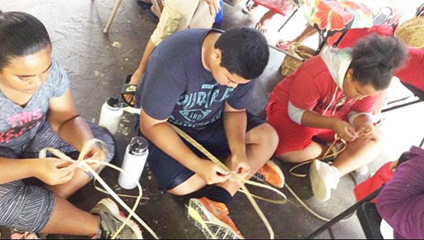 Weaving is one of the activities for the kids involved in the 2017 summer FIT program. Earlier this month, the group took a field trip to the TAOA center where they learned how to create items using dried leaves. [Courtesy photo]