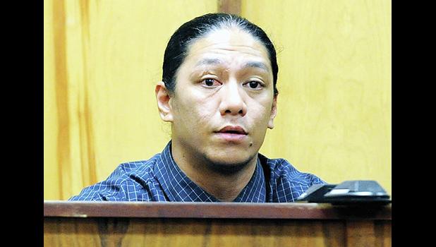 Lama Lauvao on the stand in court.