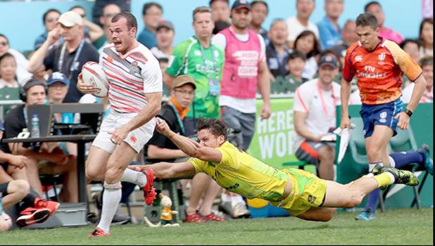 At the HSBC World Rugby Sevens Series XVIII in Hong Kong on April 8, 2017 Tom Bowen of England outruns Australian defender to score Englands second try.  Australia prevailed 12-10 to win Pool A with 9 points.   Australia will face Argentina in the Cup quarter finals.  England will play USA.