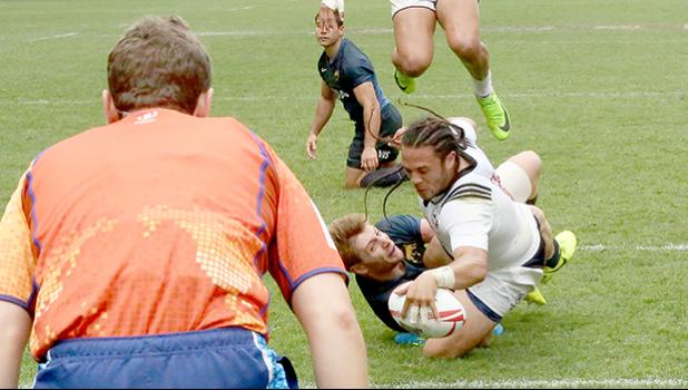 At the HSBC World Rugby Sevens Series XVIII in Hong Kong on April 8, 2017 USA's Mike Te'o scores against Argentina.  USA beat Argentina 33-5 to win Pool D.  USA will play England in the Cup quarter final.  Argentina will play Australia.