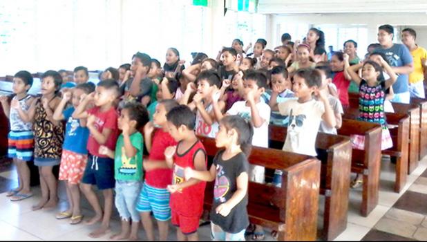 Vaimoso Methodist Church children learning their White Sunday verses.