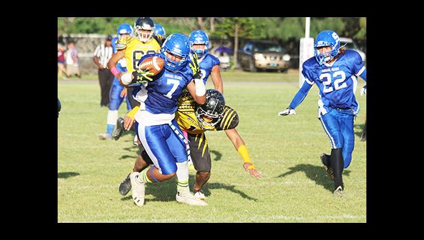 Samoana Sharks Fa’avavau Lili’o returning this kick off against a hungry Wildcats special team – just after scoring over the Sharks in the opening half of play. [photo: TG]