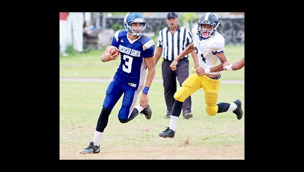 Top wide receiver JV Jurgen Krusen reading his blockers as he focused to take this one in for six for the Sharks in the second half of play – their last performance of the season as they shut out the Wildcats 18 - 0, closing off their seasonal performance on a high-note.  [photo: TG]