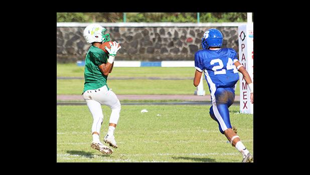 Ali’itoa Langkilde of Leone catching his first touchdown pass of the game – he led the Lions with two touchdowns that pulled Leone to their third victory of the season. [photo: TG]